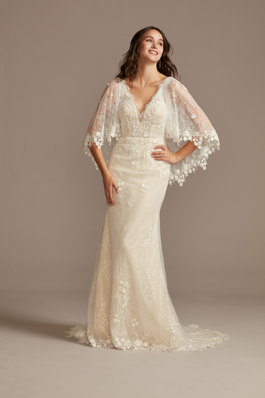 bride wearing ethereal Lace Wedding Dress with Crochet Trim Capelet