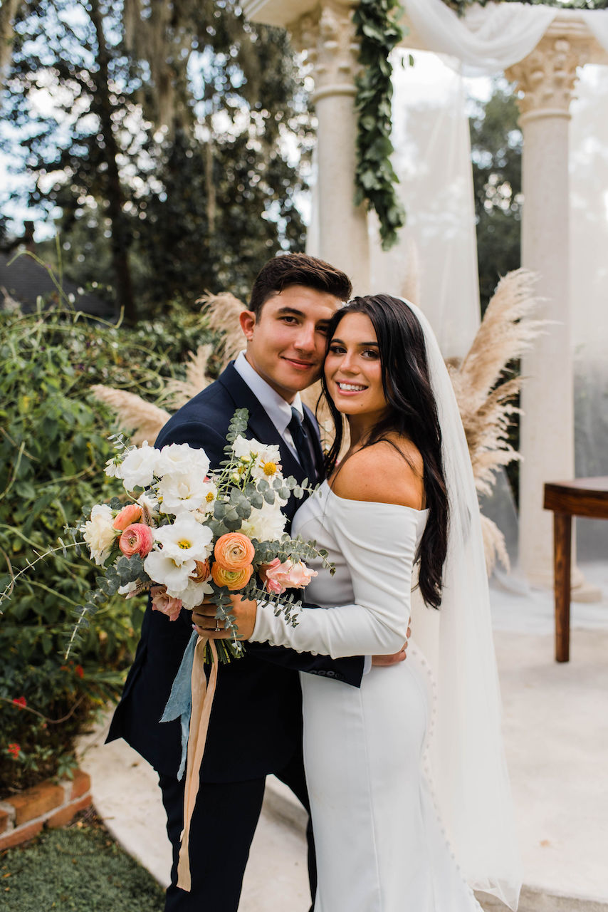 bride and groom embracing