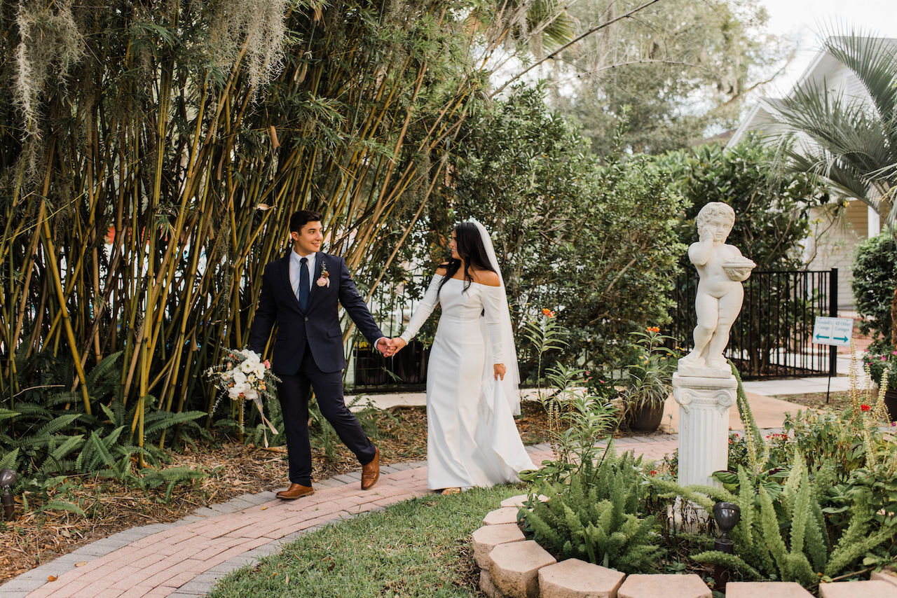 bride and groom walking at their intimate and romantic wedding in florida