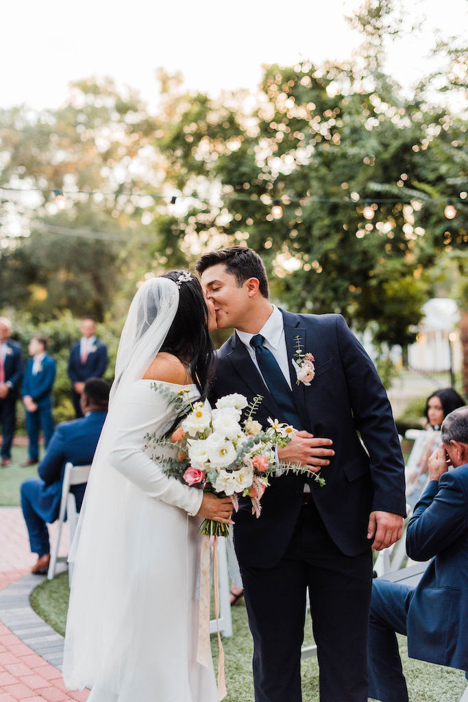 bride and groom kissing at their intimate and romantic wedding in florida