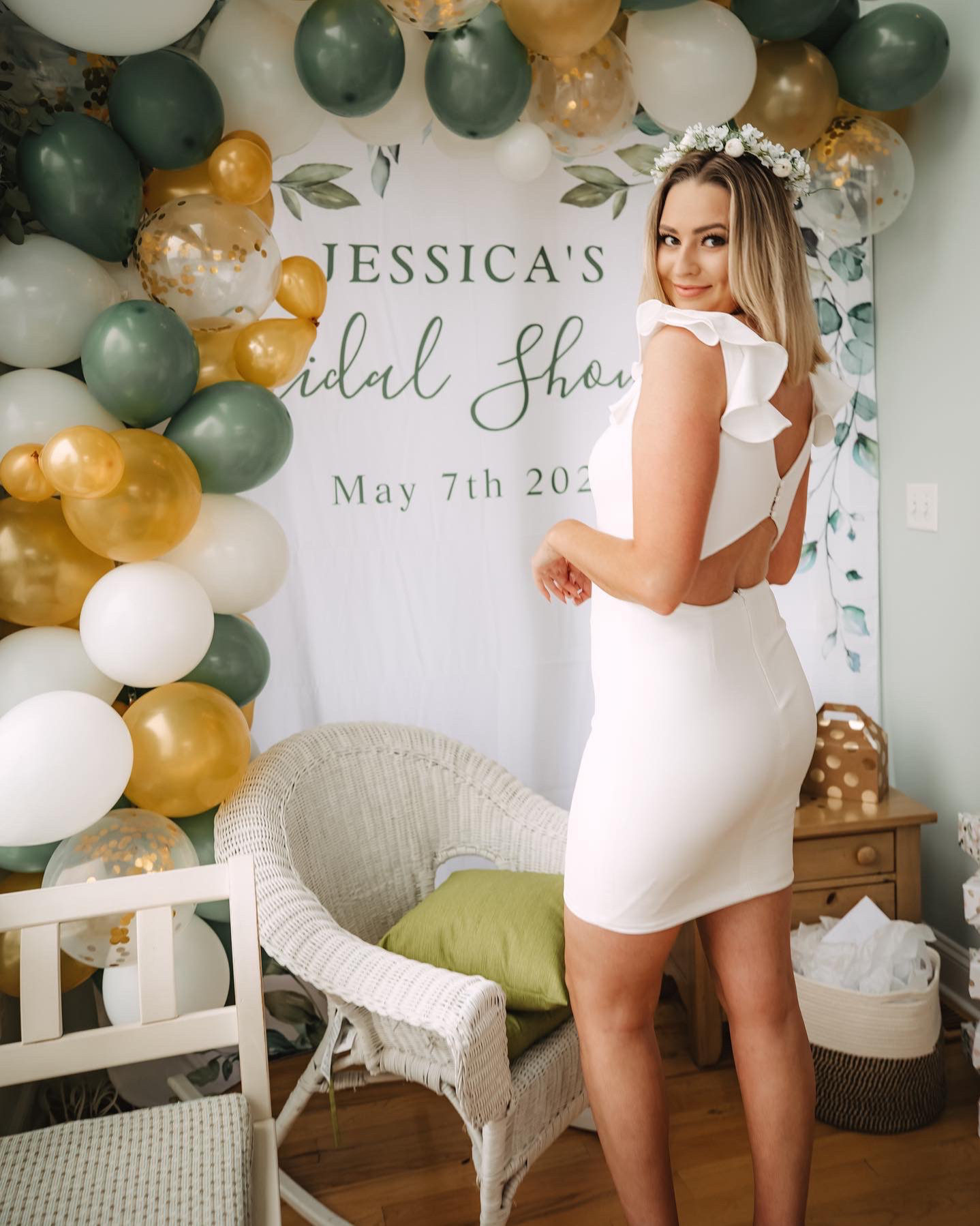 bride to be at her bridal shower in little white dress