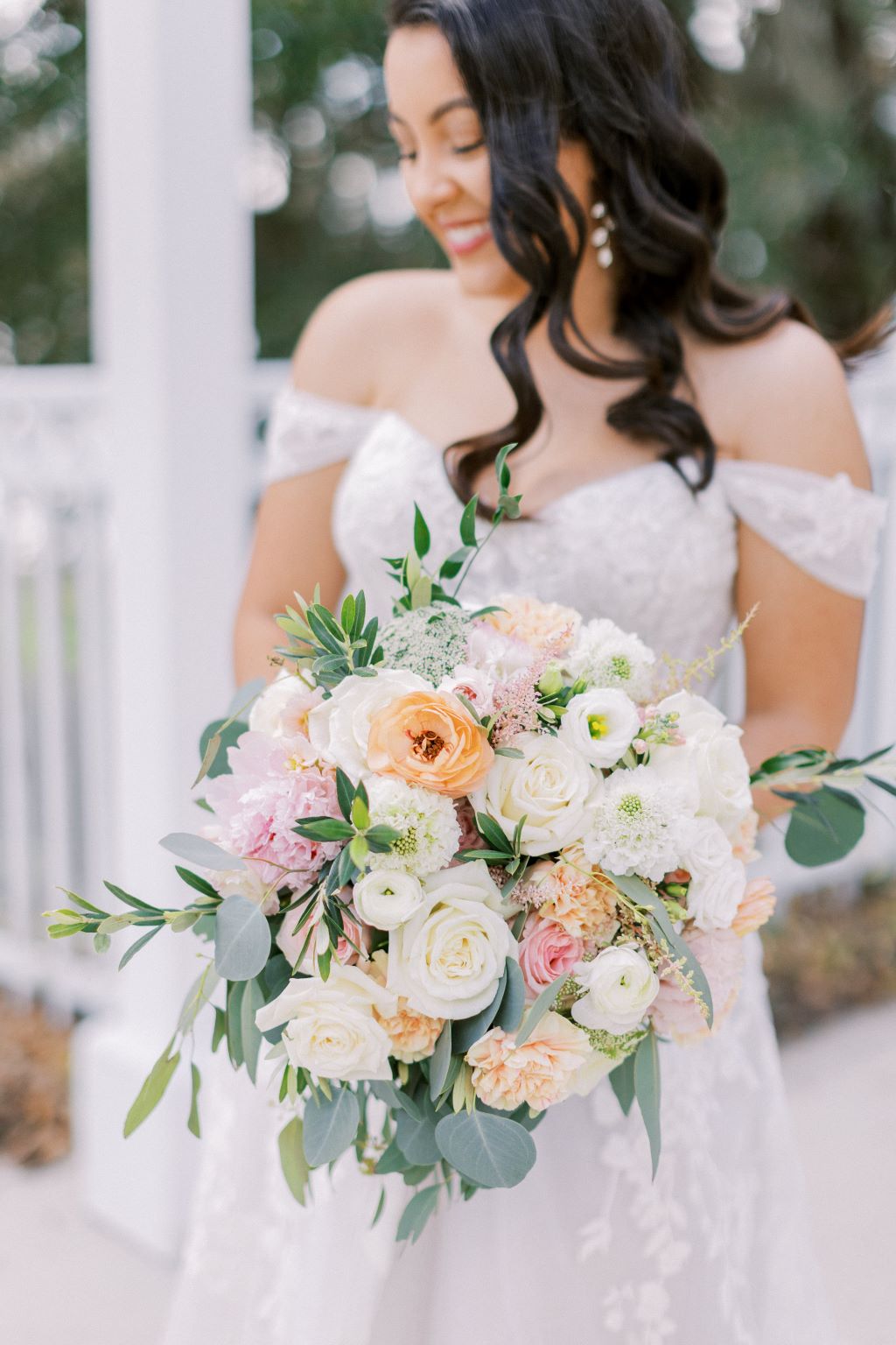 bride holds beautiful blush colored bouquet 