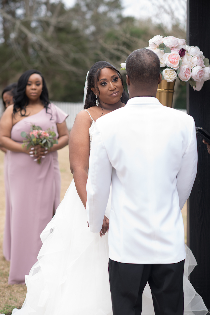 bride and groom at altar