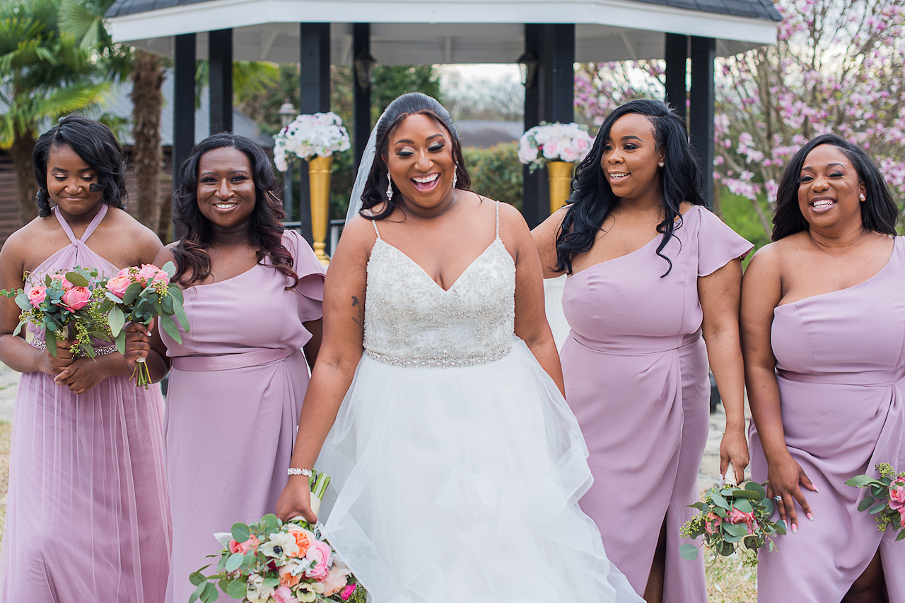 bride and bridesmaids at outdoor fairytale wedding 