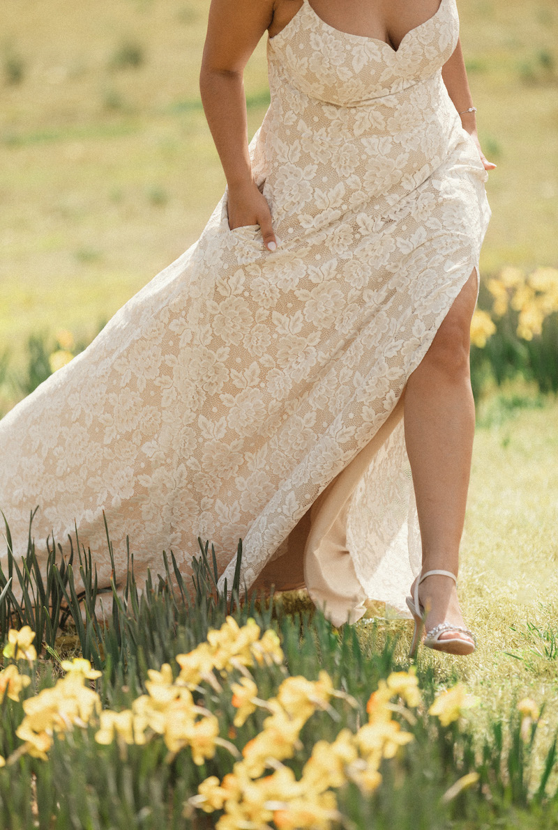 A bride walking through a garden