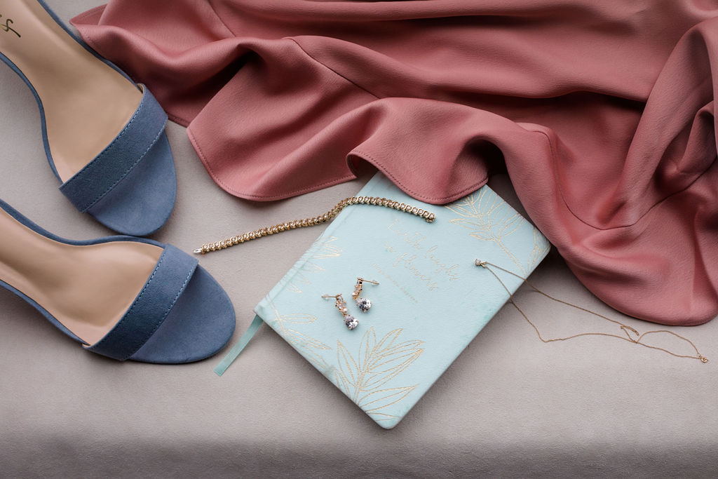 flatlay of wedding shoes and jewelry for dreamy springtime wedding
