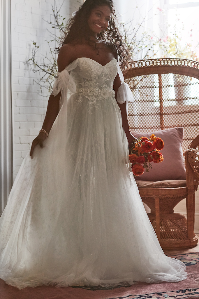 bride wearing tulle wedding dress embellished with beads, sequins, and crystals 