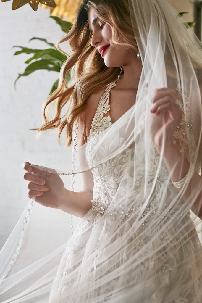 bride wearing wedding dress and veil
