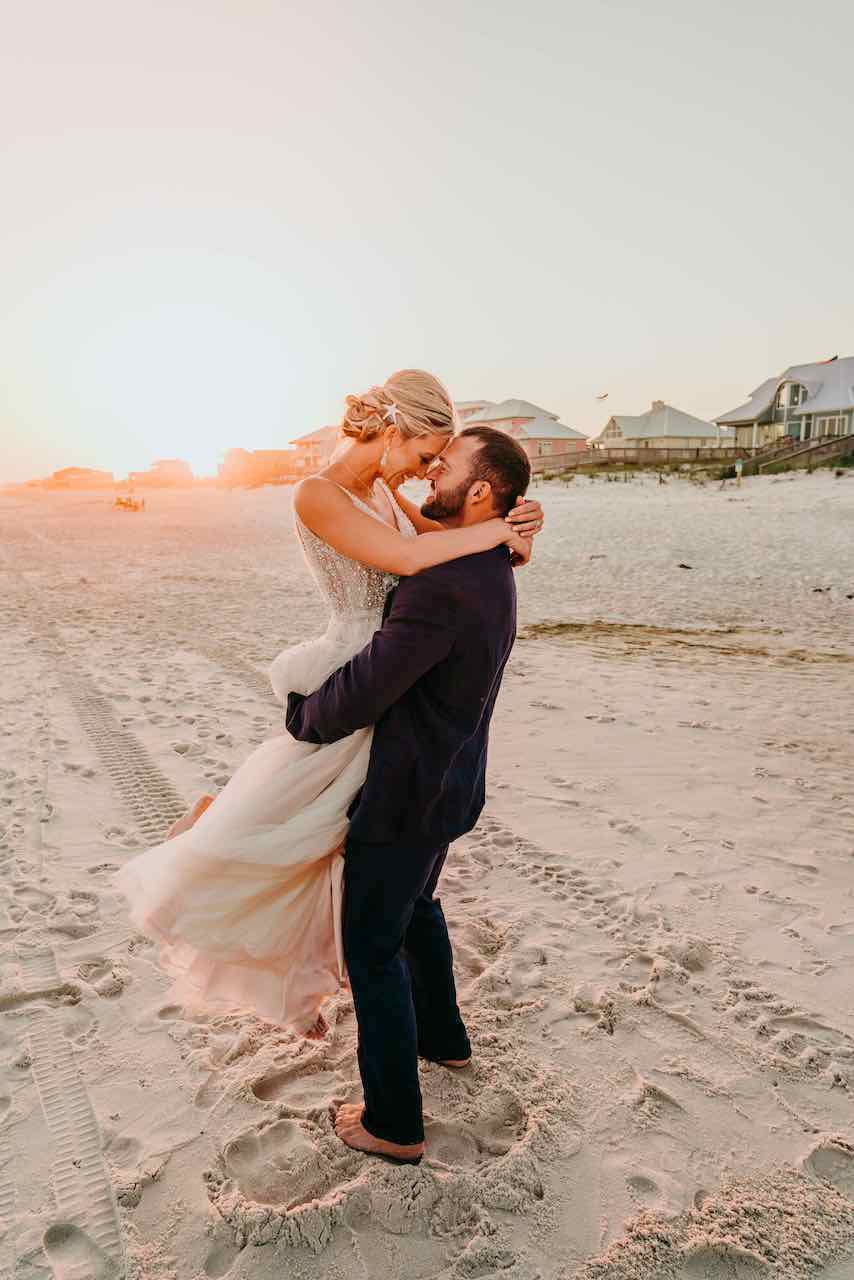 bride and groom at their romantic beach wedding in Alabama 