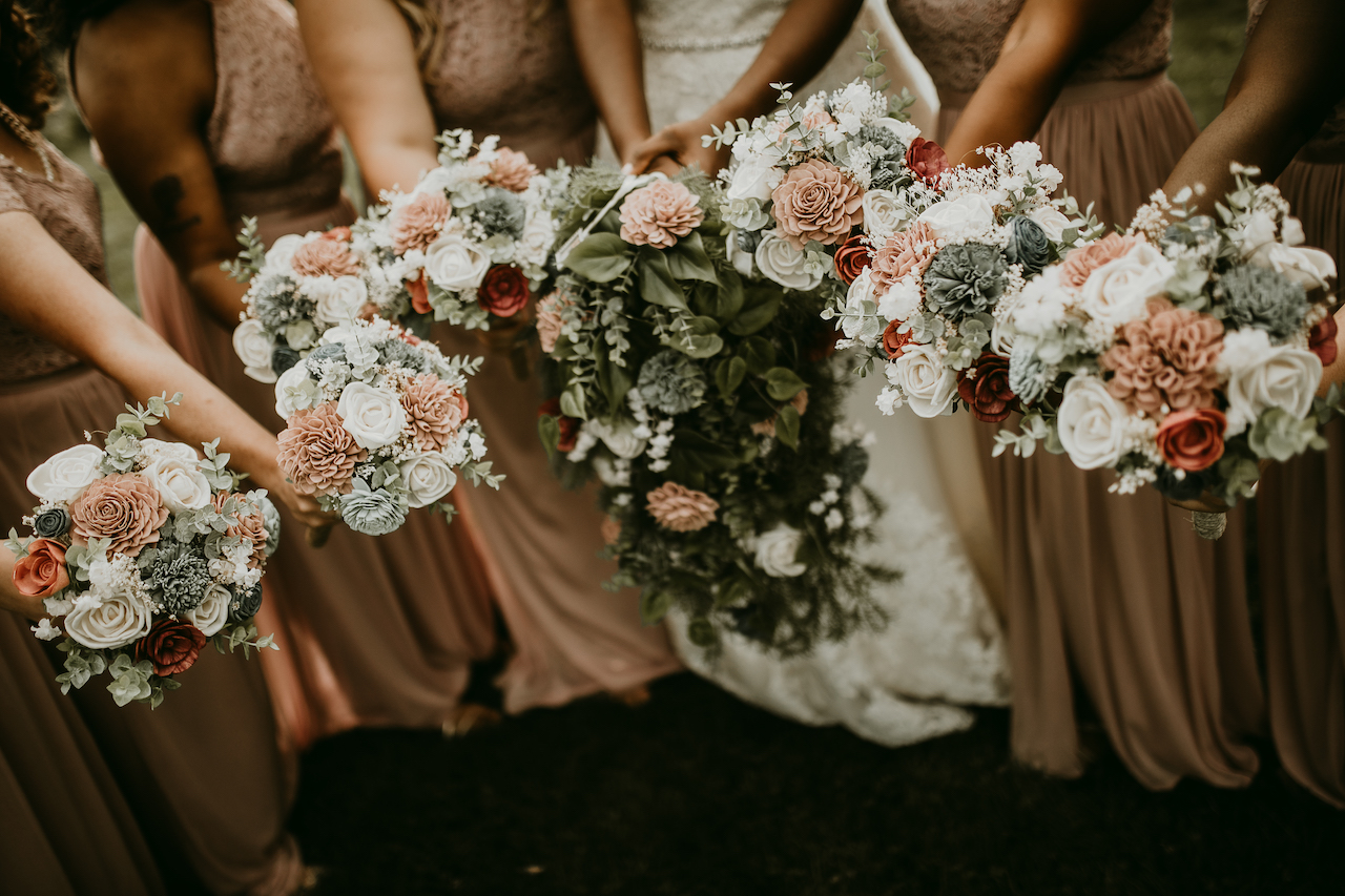 bride and brides with wooden flowers