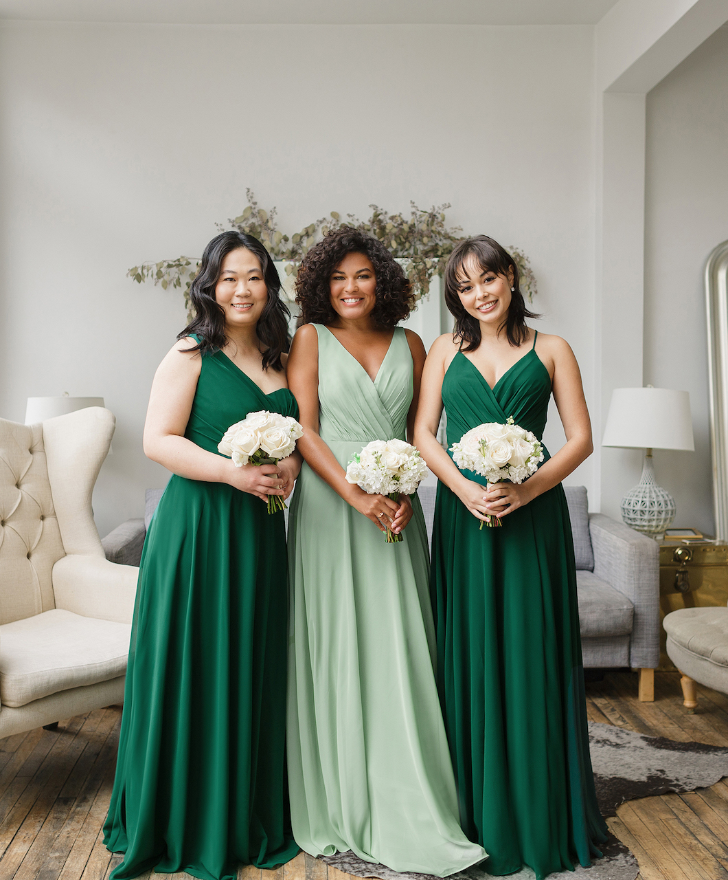 3 bridesmaids wearing green mix and match bridesmaid dresses