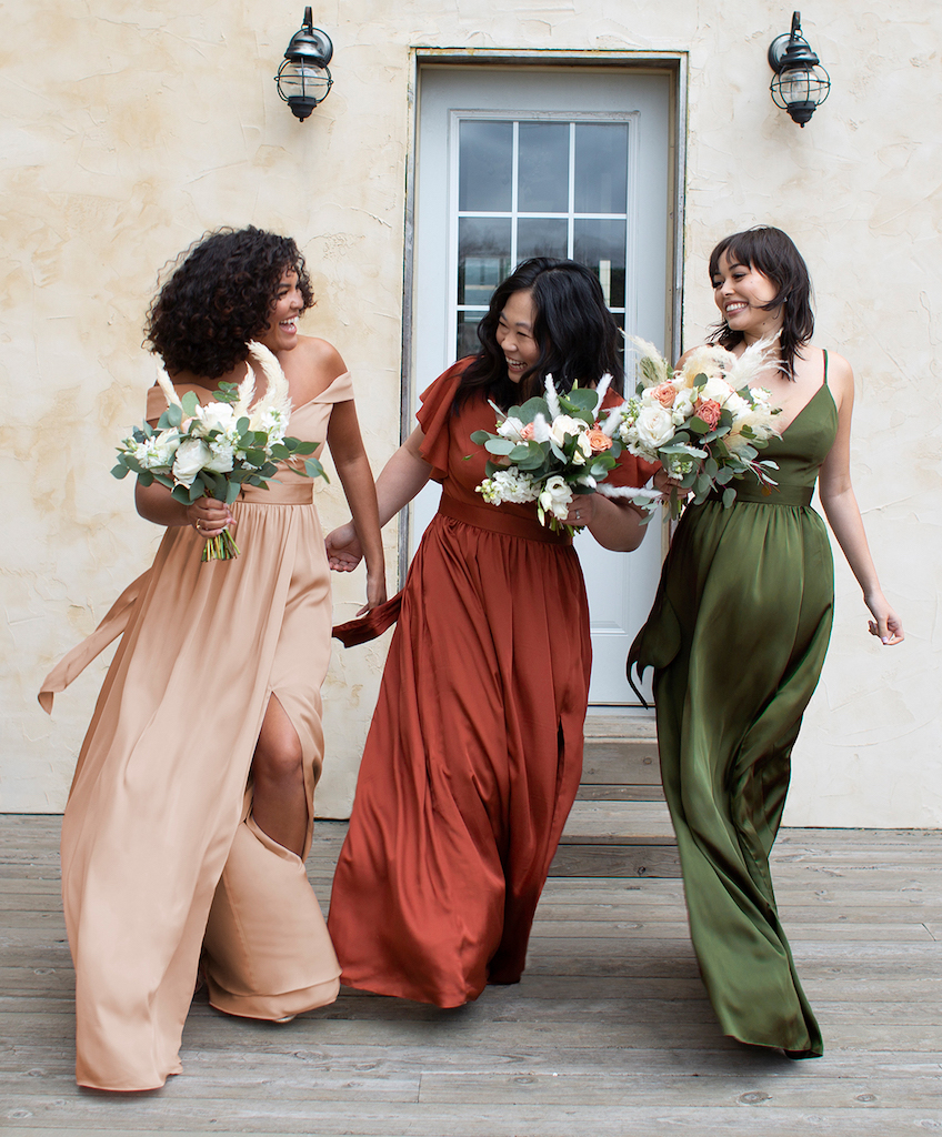 3 bridesmaids in mix and match bridesmaid dresses in sand, cinnamon, and martini olive