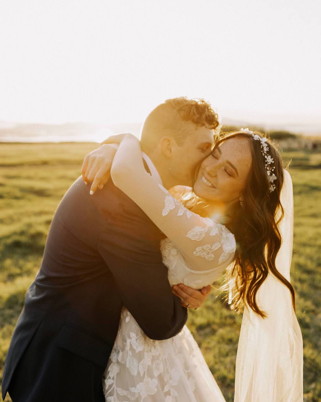 bride and groom embracing