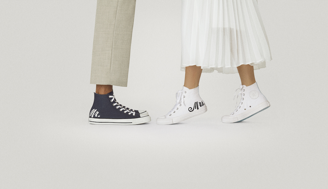 bride and groom wearing custom wedding sneakers