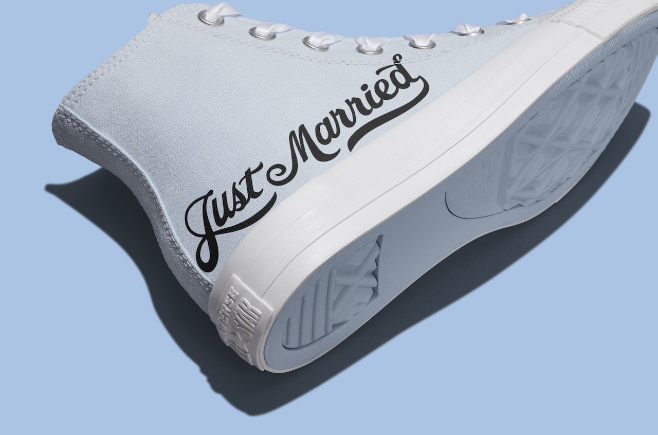 light blue custom wedding sneakers with the writing 'just married"