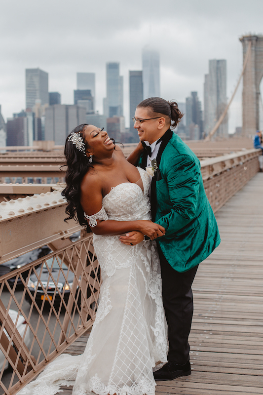 bride and groom on bridge