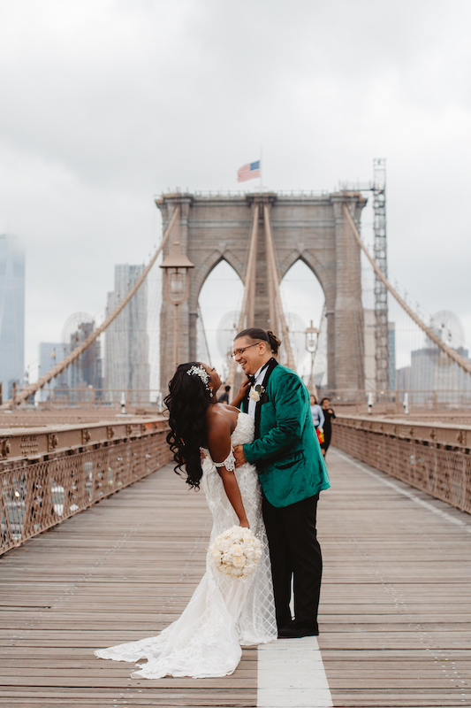 bride and groom on bridge at wedding in new york city