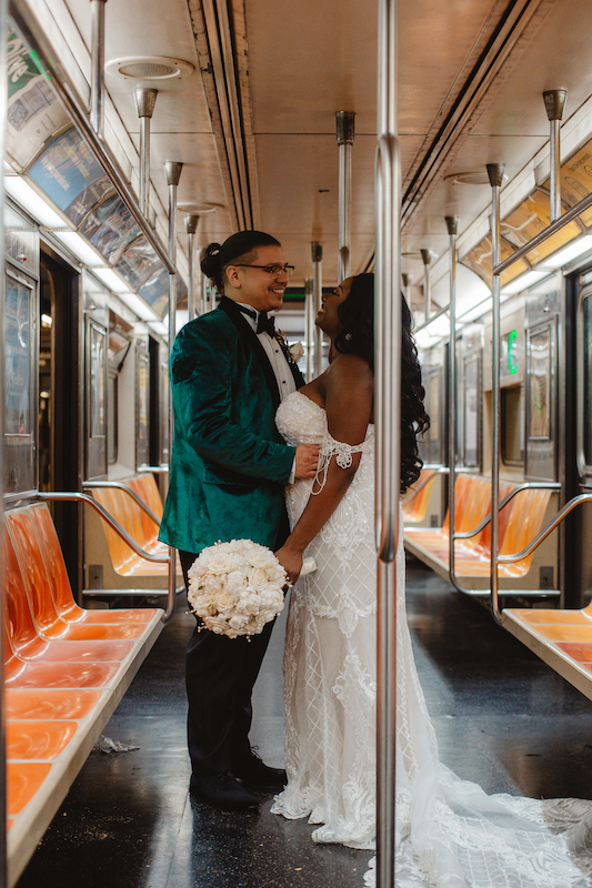bride and groom on the subway at their september wedding in new york city