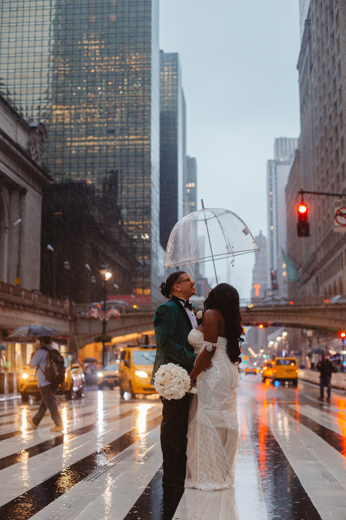 bride and groom in the rain