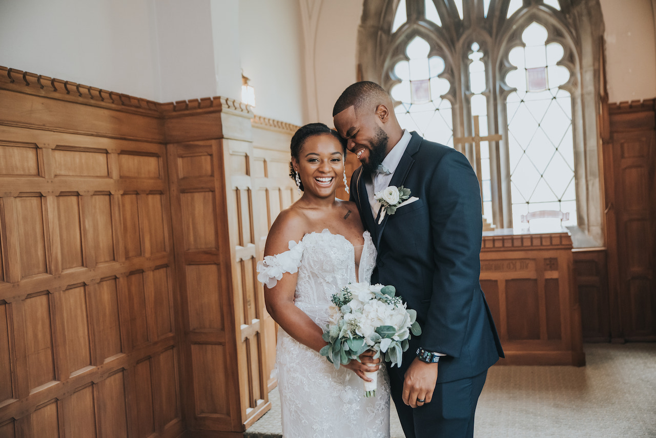 bride and groom laughing 