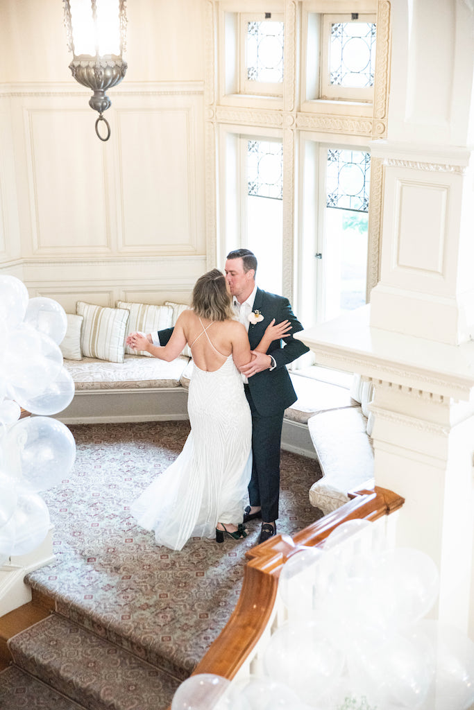 bride and groom dancing at whimsical wedding reception