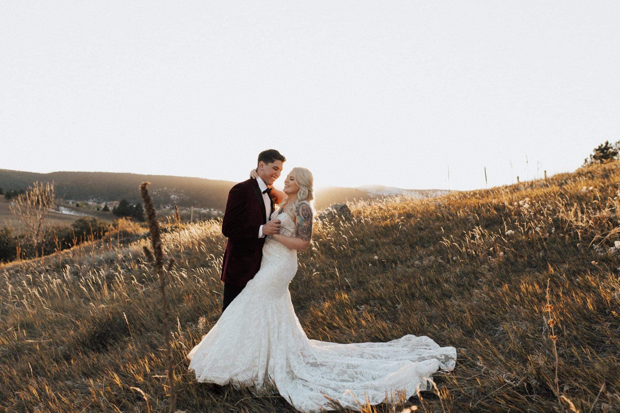 groom dipping bride at outdoor fall wedding