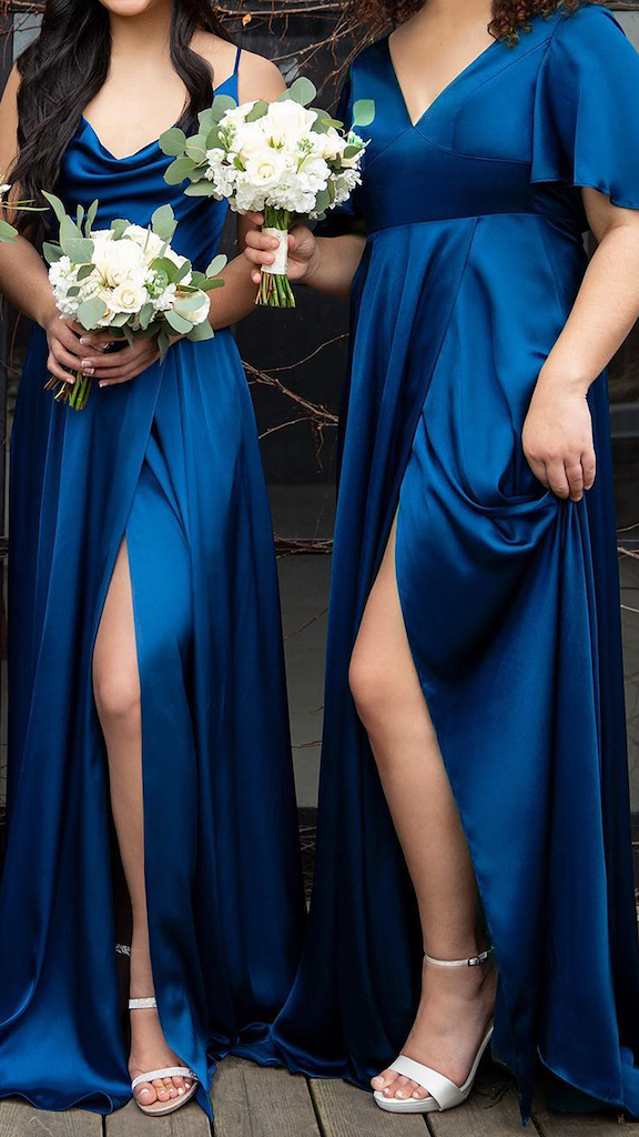 Bridesmaids in silk bridesmaid dresses in the color sapphire