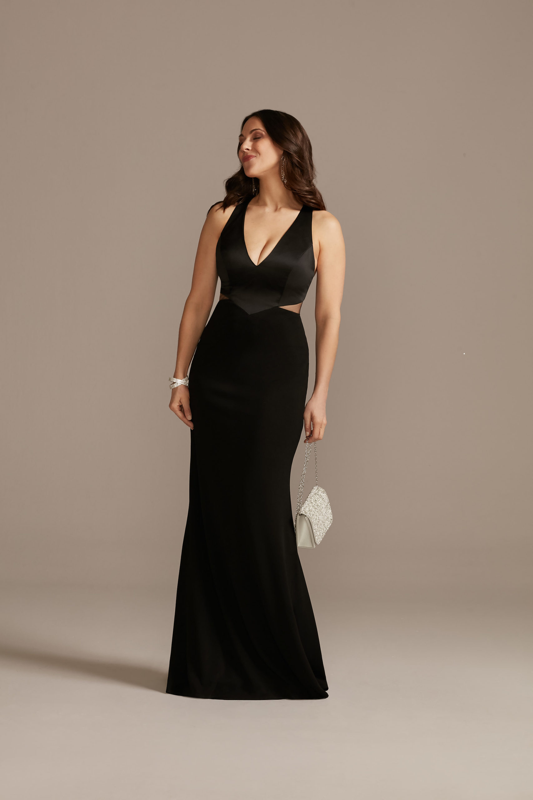 New Years Eve Outfit Inspiration black gown with side cutouts