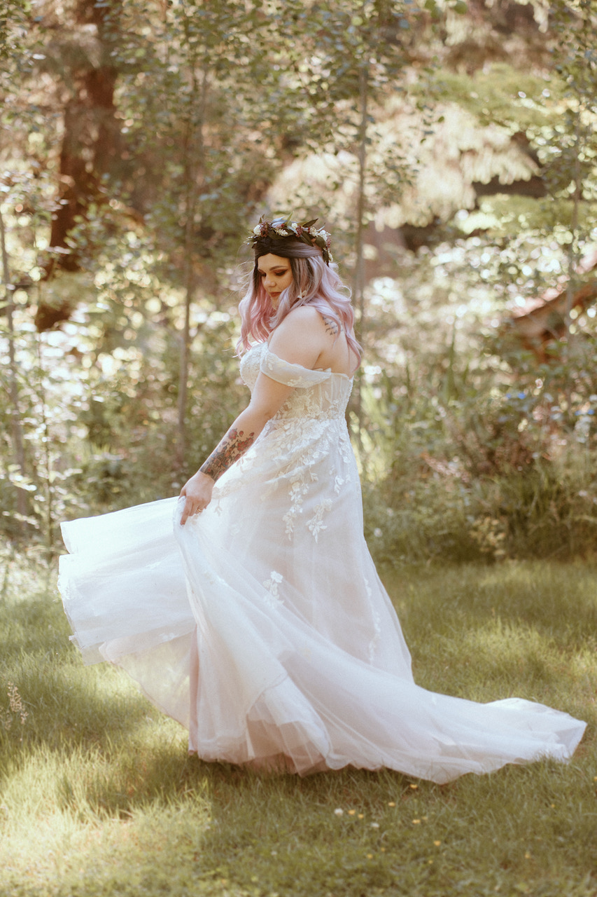 bride twirling in wedding dress at mount rainer
