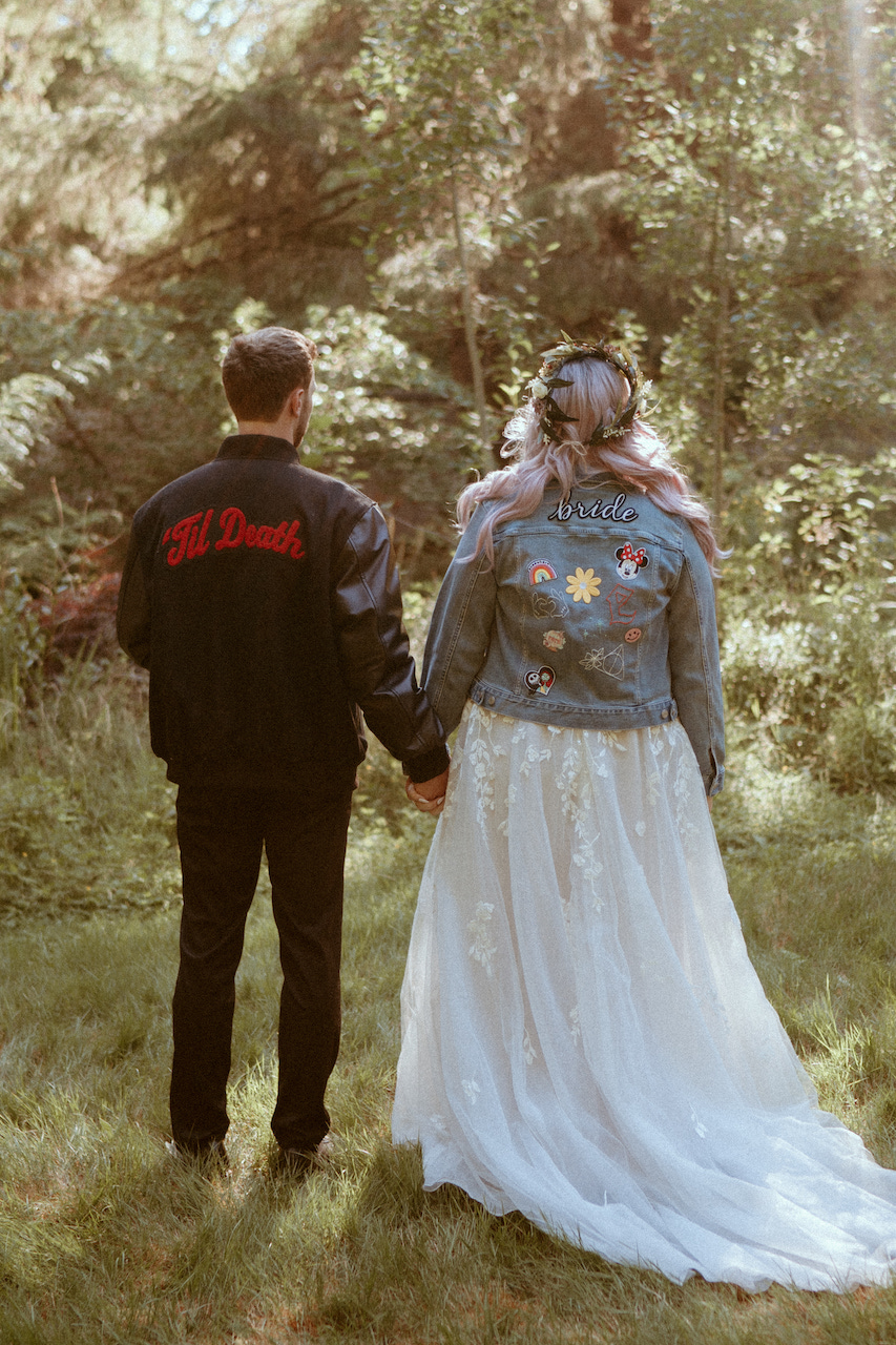 bride and groom in jackets