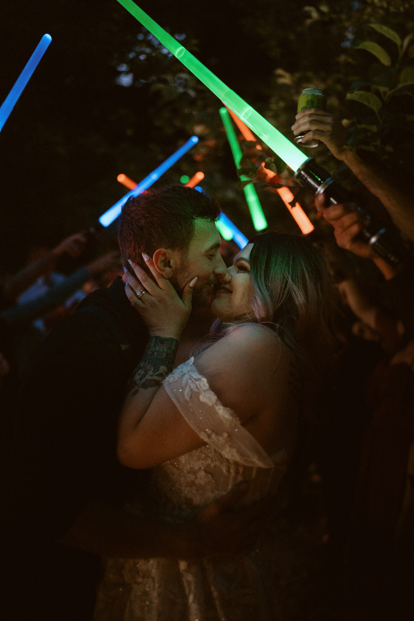 bride and groom lightsaber exit 