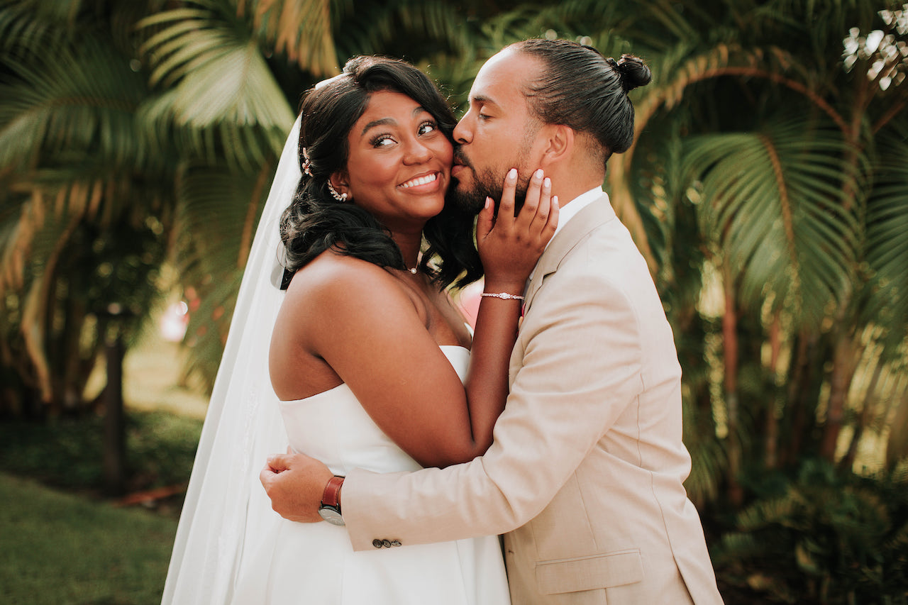 bride and groom embracing at summer wedding in Orlando
