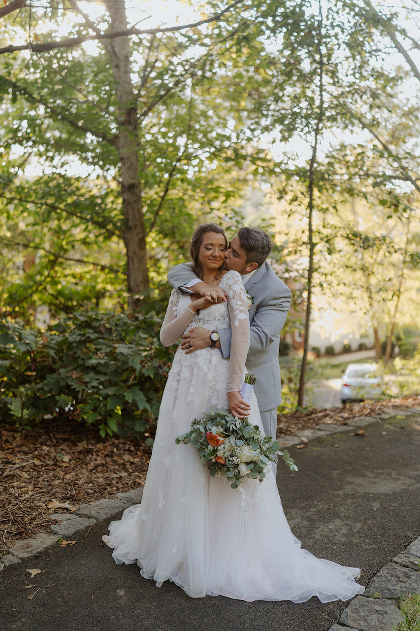 bride and groom embracing 