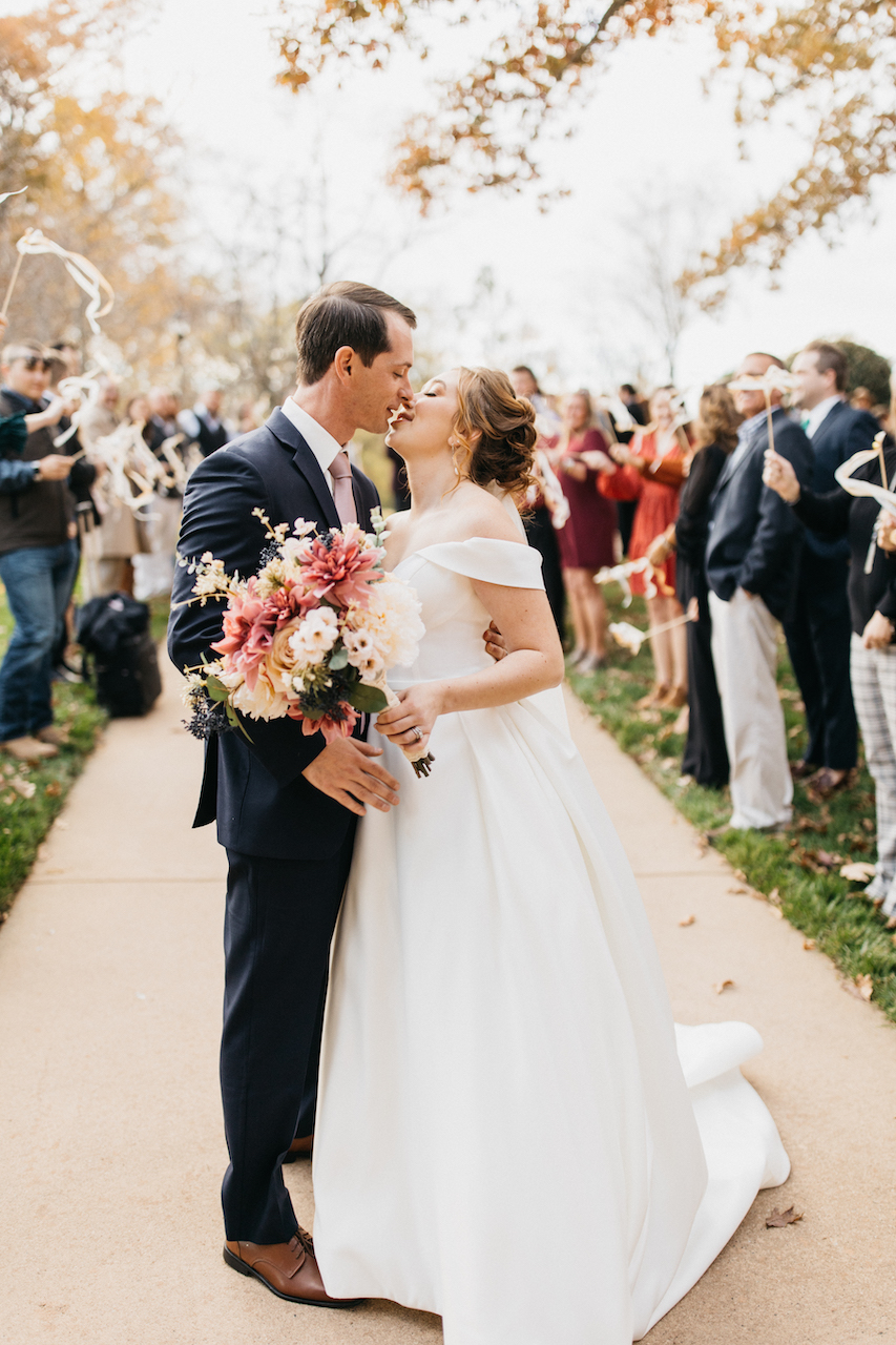 bride and groom kissing at romantic wedding in north carolina