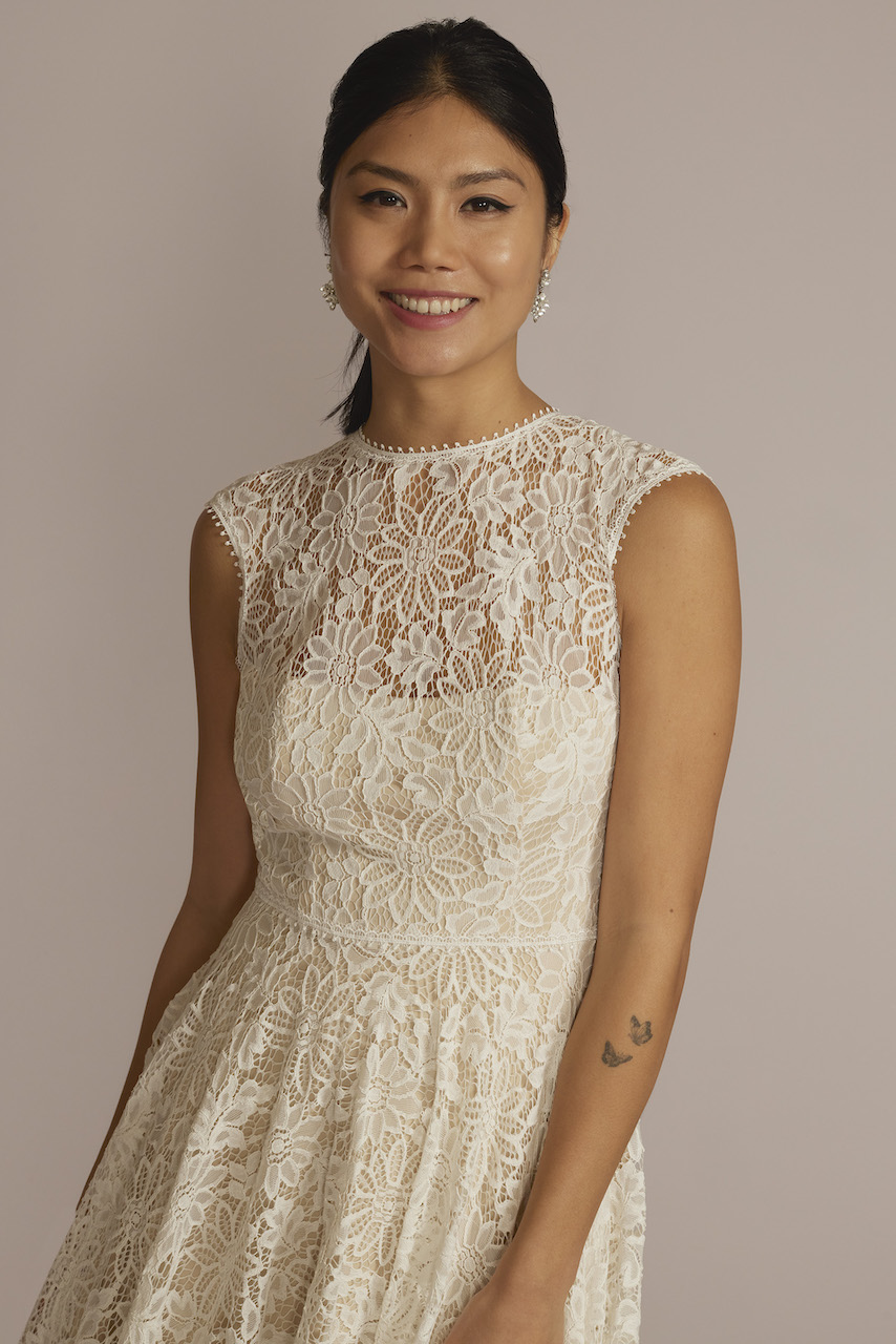 model in High-Neck Lace Dress with Asymmetrical Skirt 