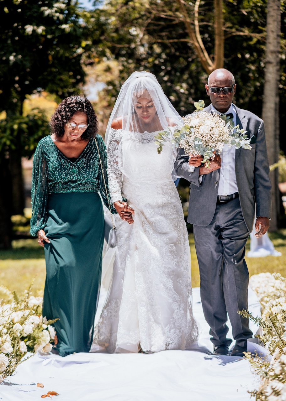 bride and parents at rustic wedding in kenya