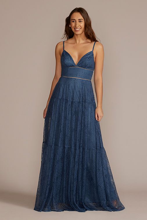 Woman in a long blue lace dress