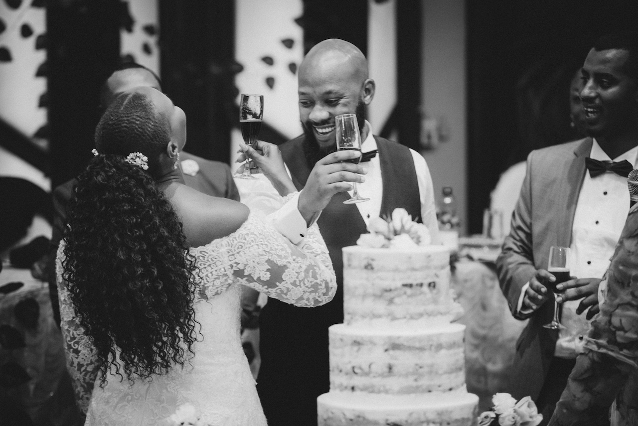 bride and groom toasting at reception