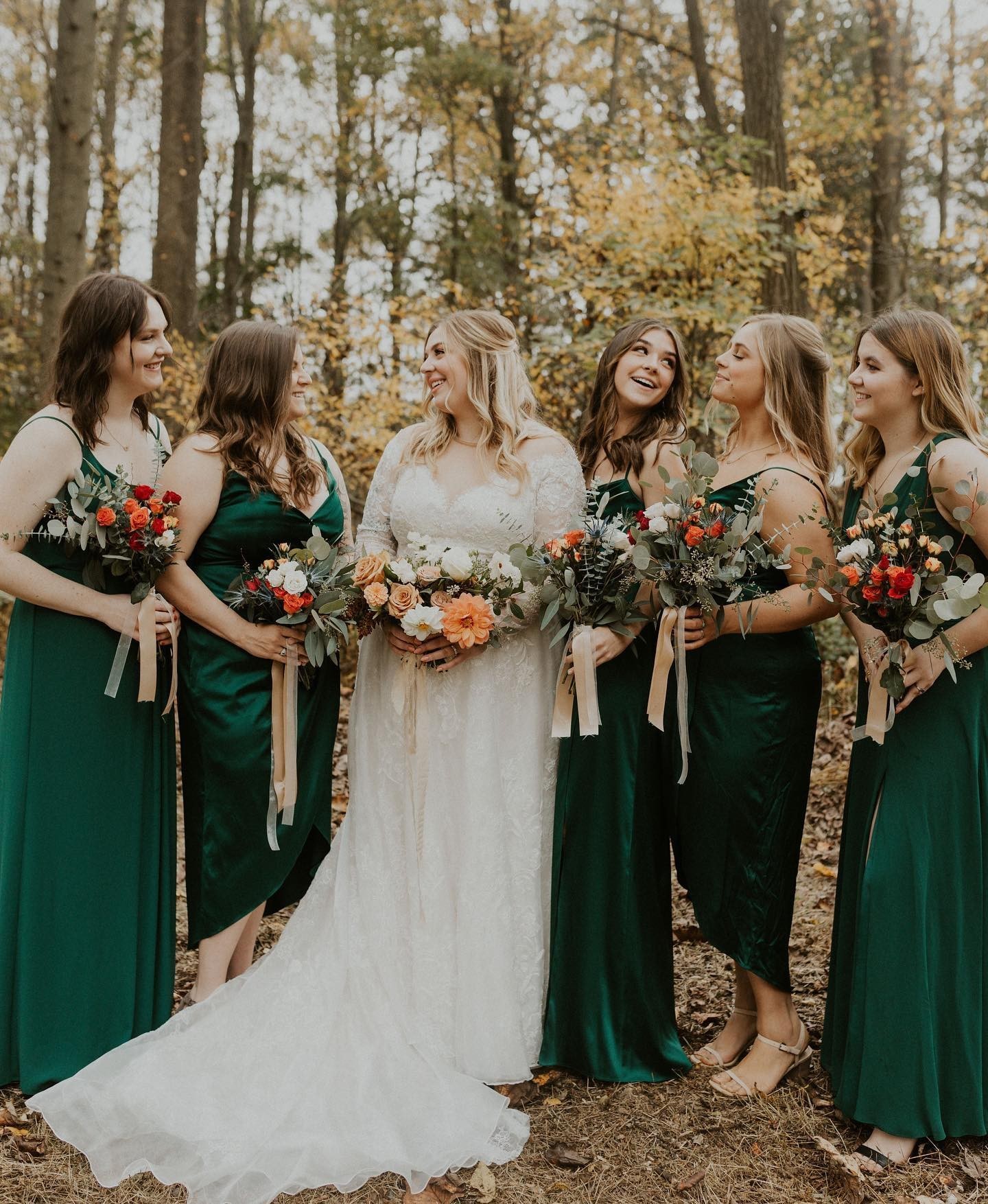 bridal party wearing green bridesmaid dresses