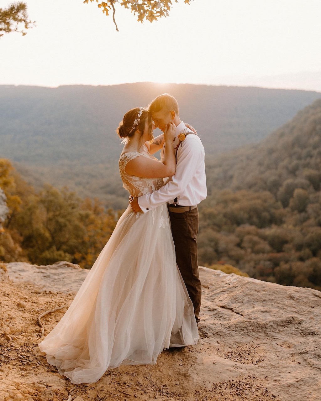 bride and groom kissing at golden hour