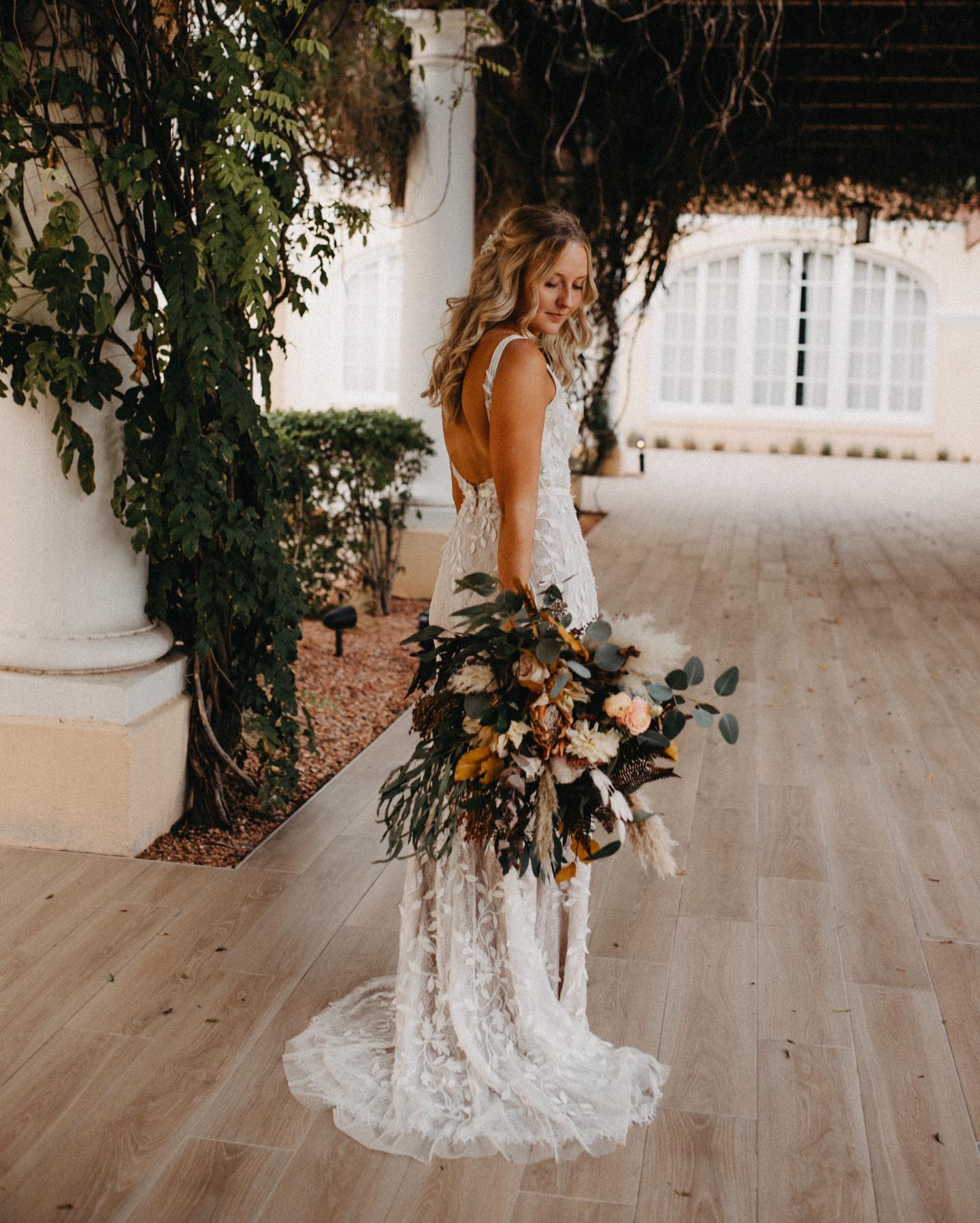 3D Leaves Applique Lace V-Neck Wedding Dress - bride holding bouquet