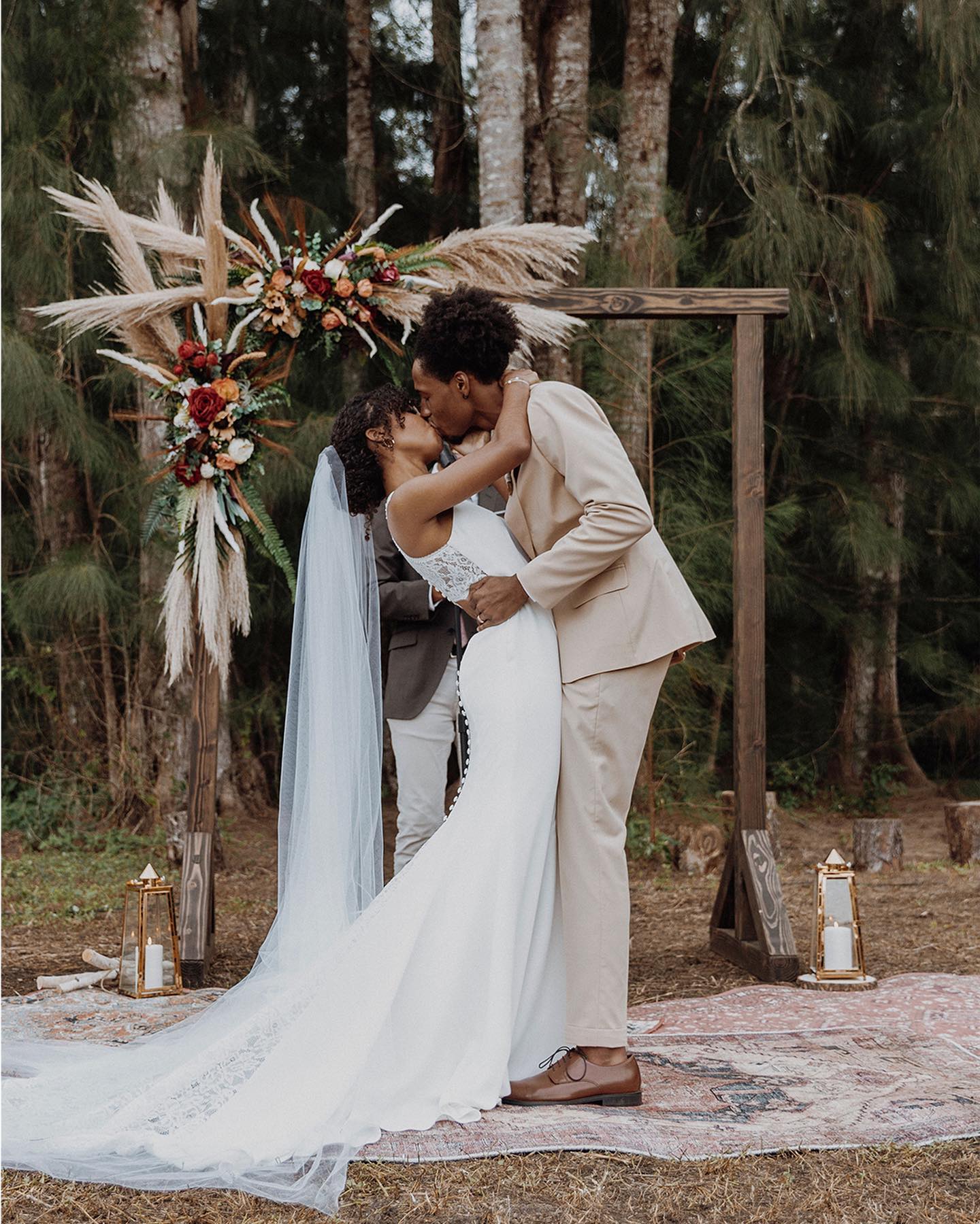 bride and groom kissing at forest wedding