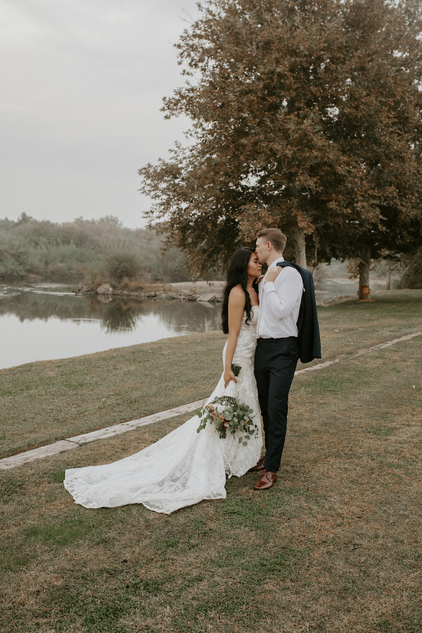 bride and groom embracing