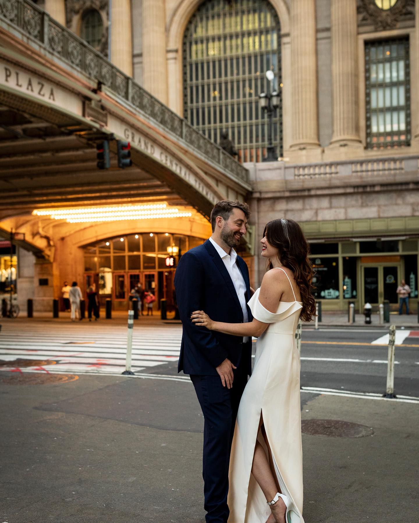man and women posing at grand central station