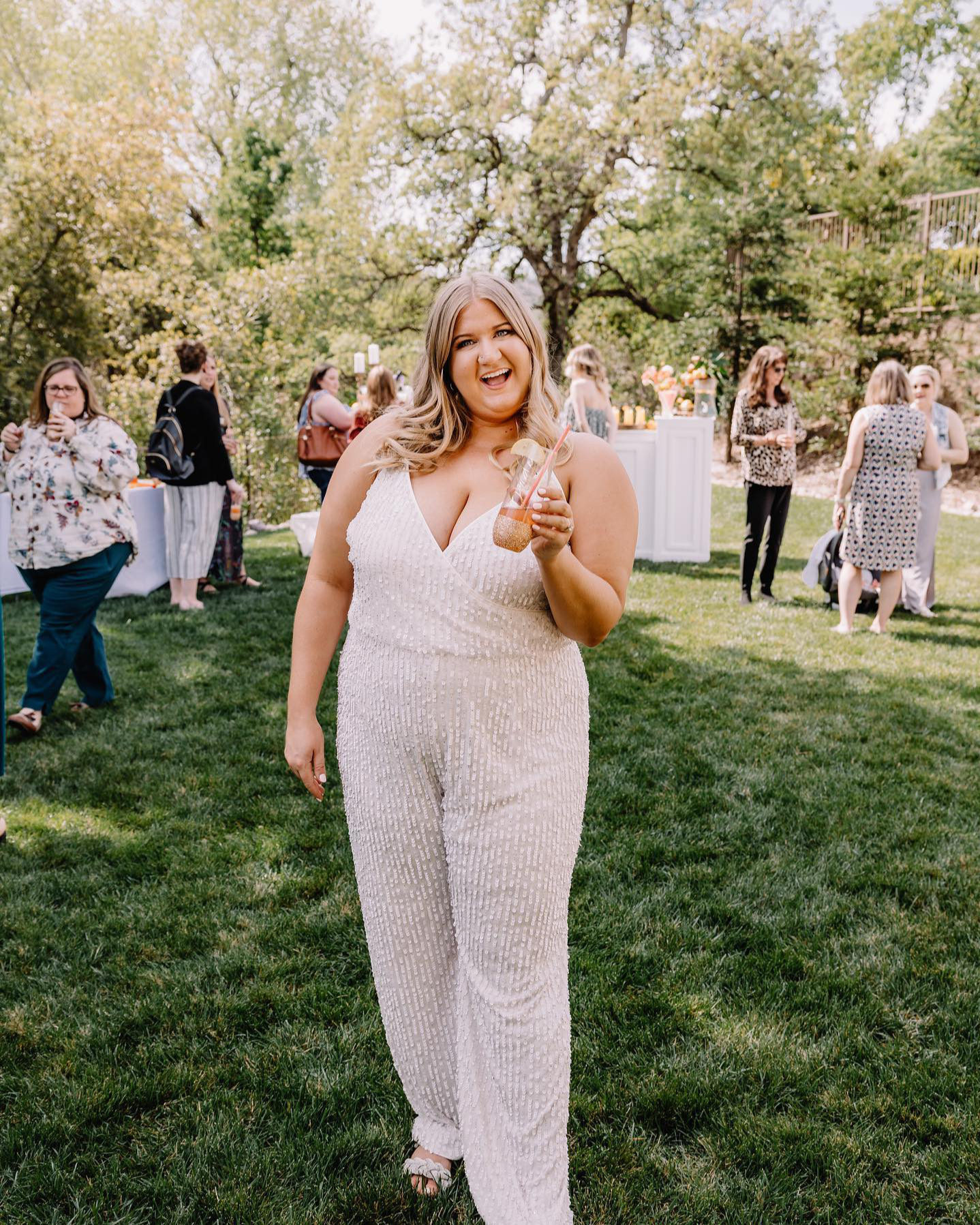 women in sparkly jumpsuit