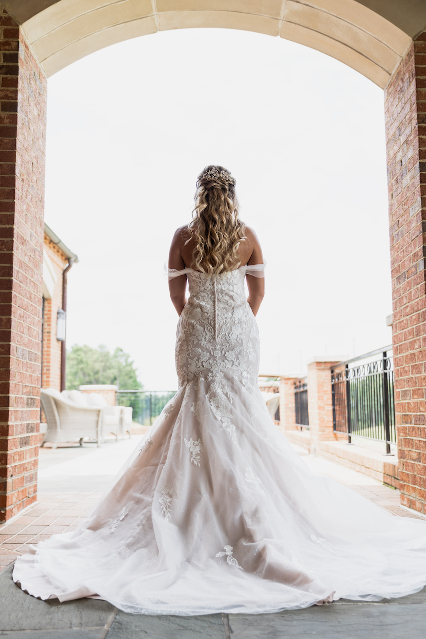 bride walking away in wedding dress - summer wedding in Georgia 