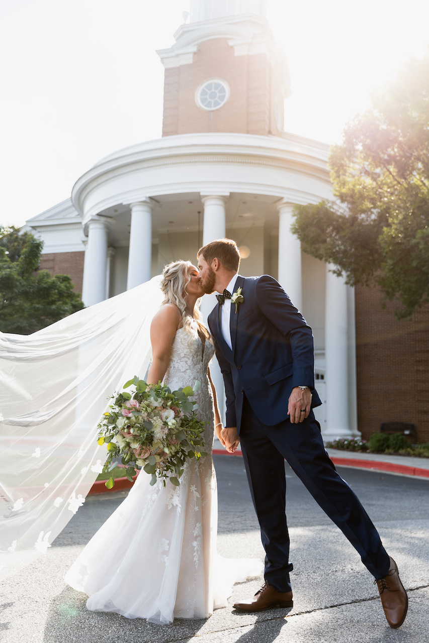 bride and groom kissing - summer wedding in Georgia 