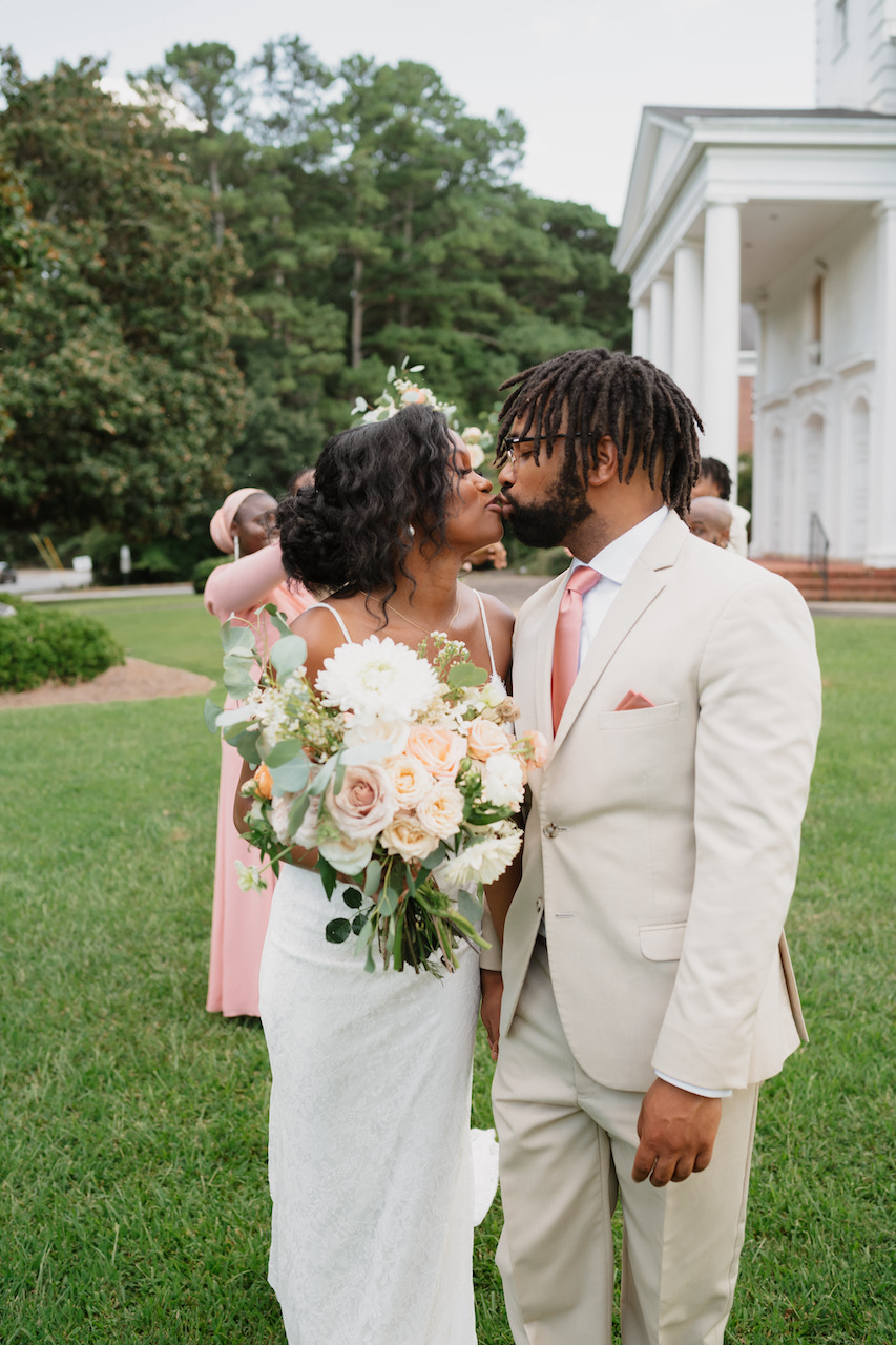 bride and groom kissing - backyard wedding in Georgia.