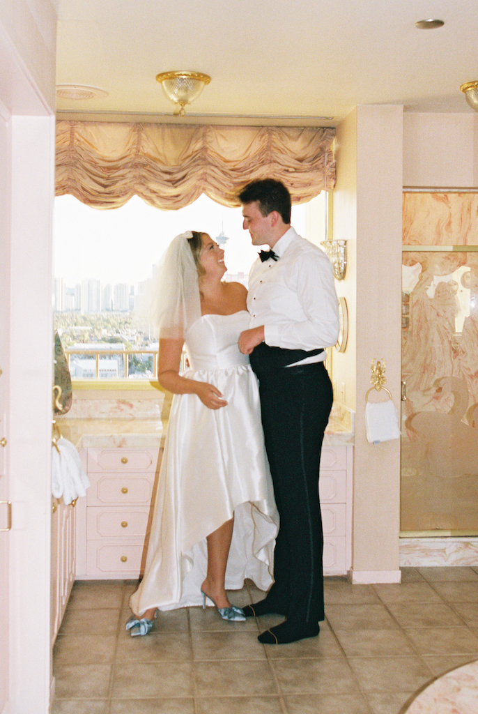 bride and groom in hotel room