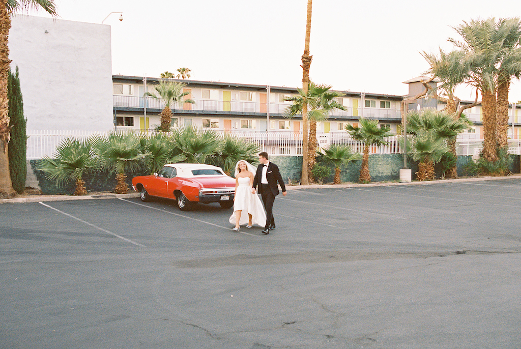 bride and groom walking hand in hand